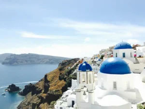 Blue-domed churches overlooking the sea in Santorini, Greece