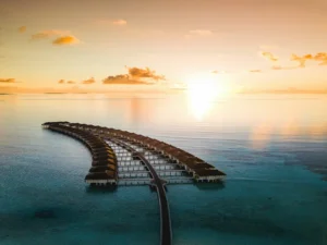 Overwater bungalows at sunset in the Maldives