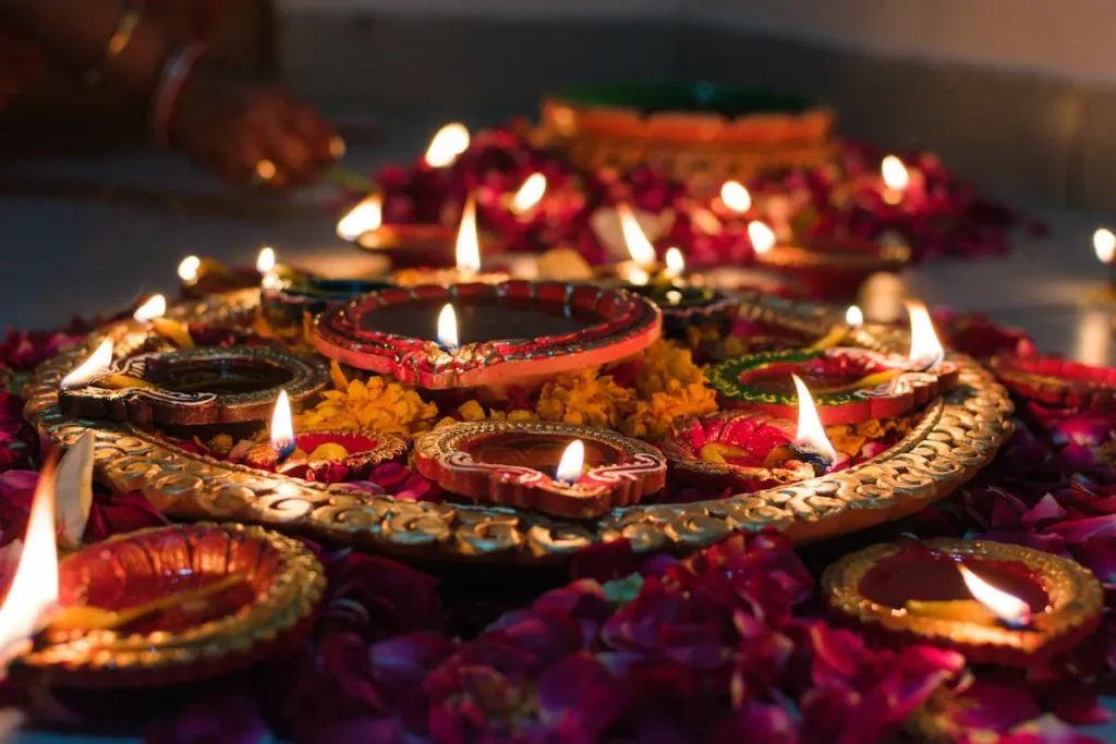 "Diya oil lamps arranged with flower petals for Diwali celebrations, India