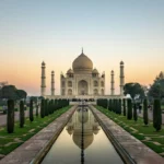 Taj Mahal at sunrise reflected in the garden pool, Agra, India