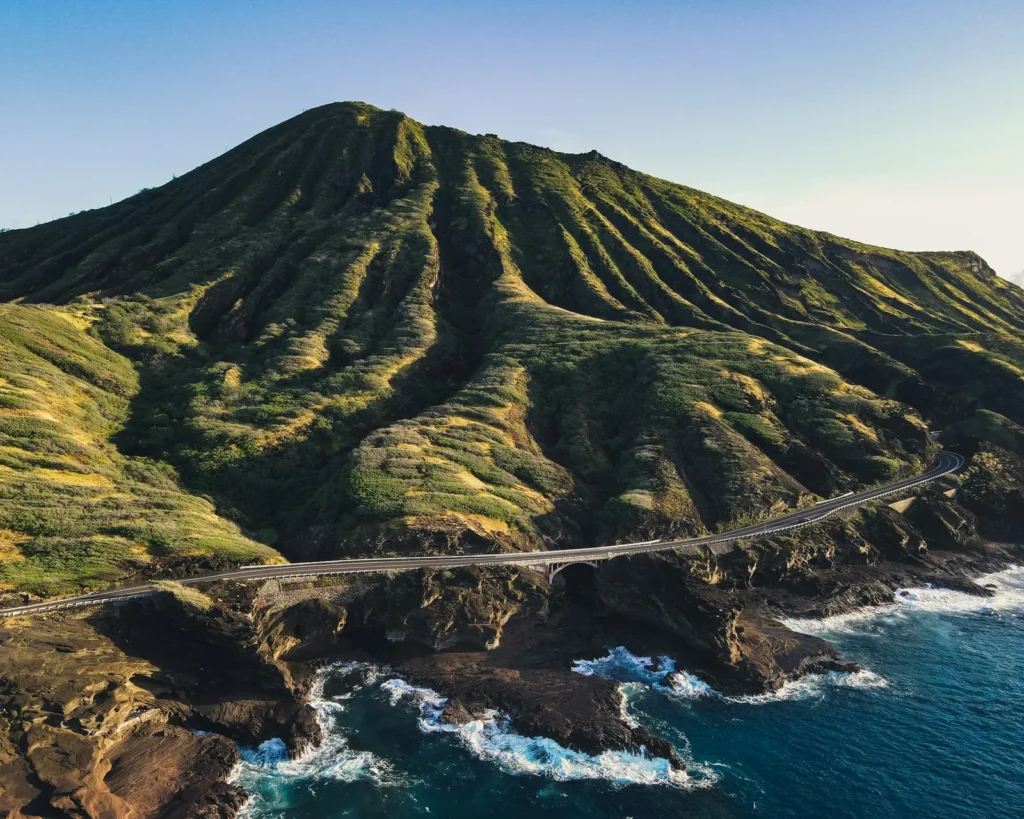 Coastal highway bridge along a rugged volcanic Oahu-style coastline