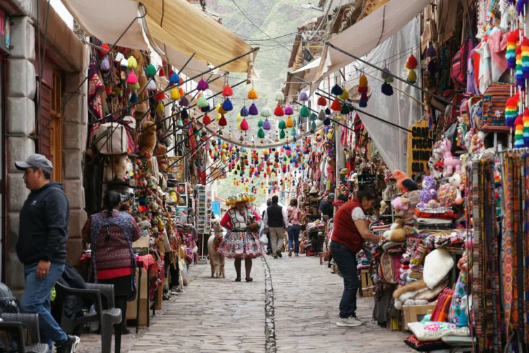 Colorful textile stalls and tassels in the Pisac market, Sacred Valley, Peru