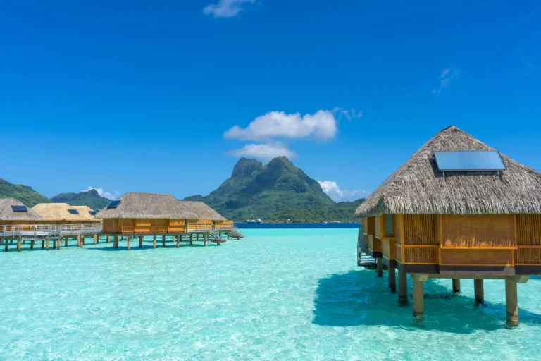Overwater bungalows in Bora Bora with Mount Otemanu in the background