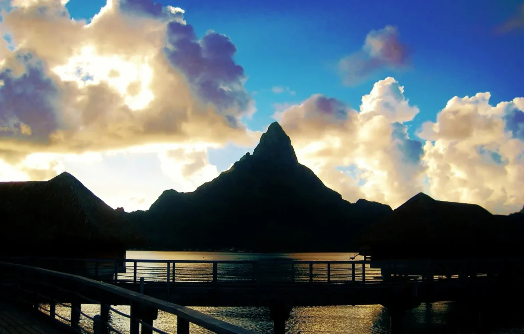 Silhouette of Mount Otemanu and overwater bungalows at sunset, Bora Bora