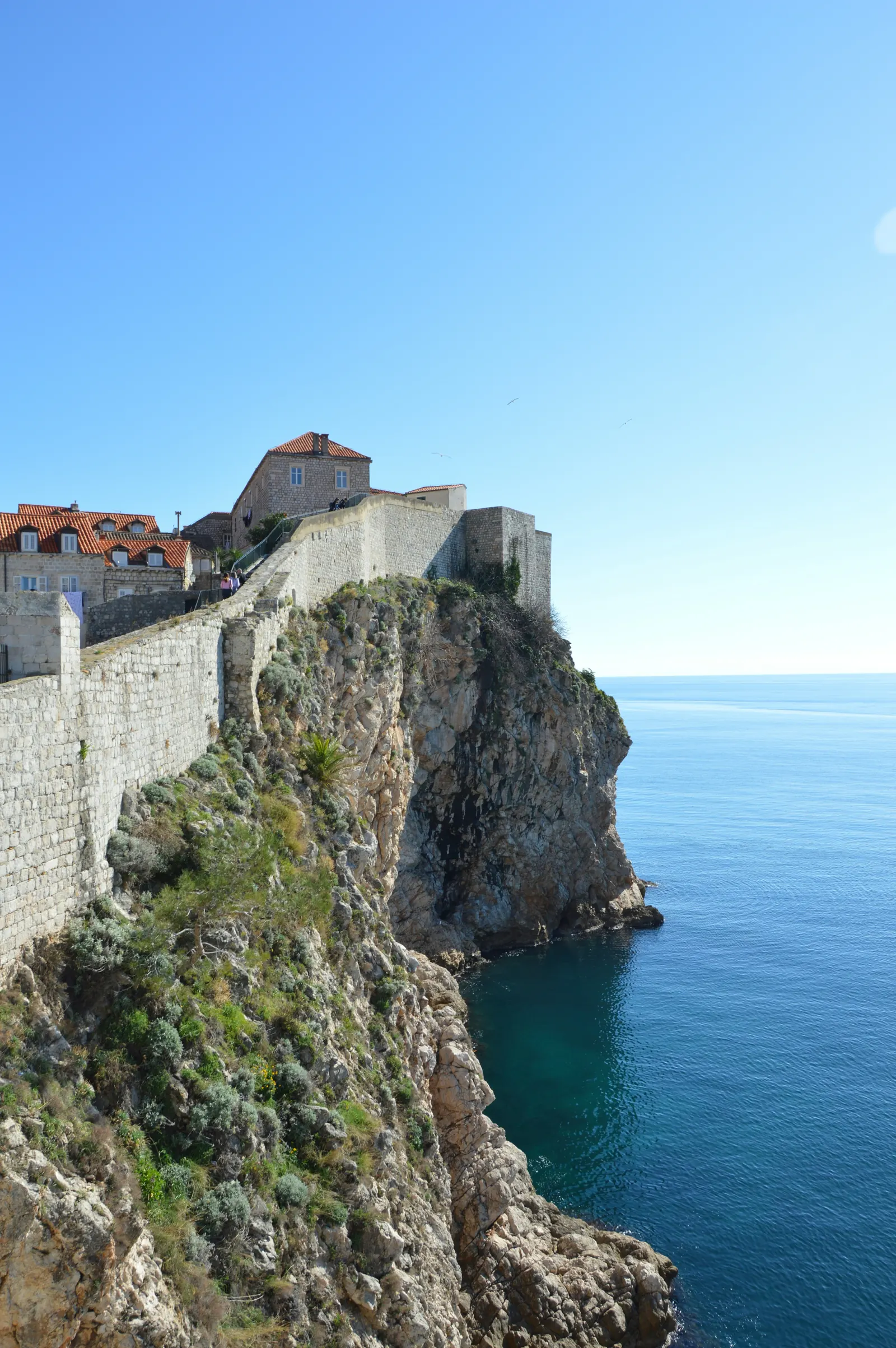 Dubrovnik’s medieval city walls perched on cliffs above the Adriatic Sea