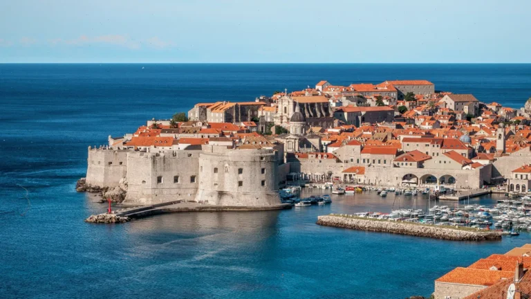 Aerial view of Dubrovnik's walled old town and harbor on the Adriatic coast