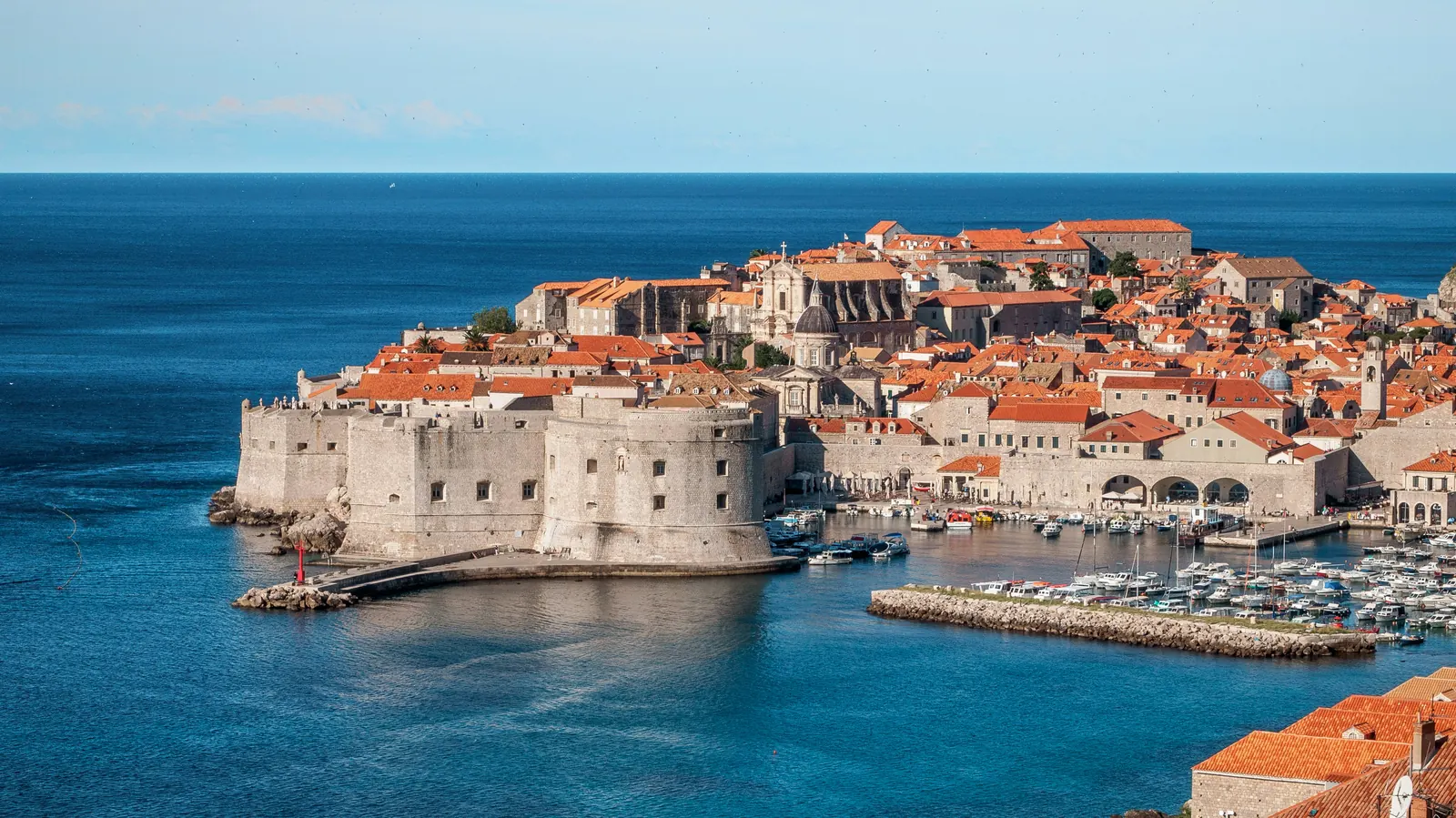 Aerial view of Dubrovnik’s walled old town and harbor on the Adriatic coast
