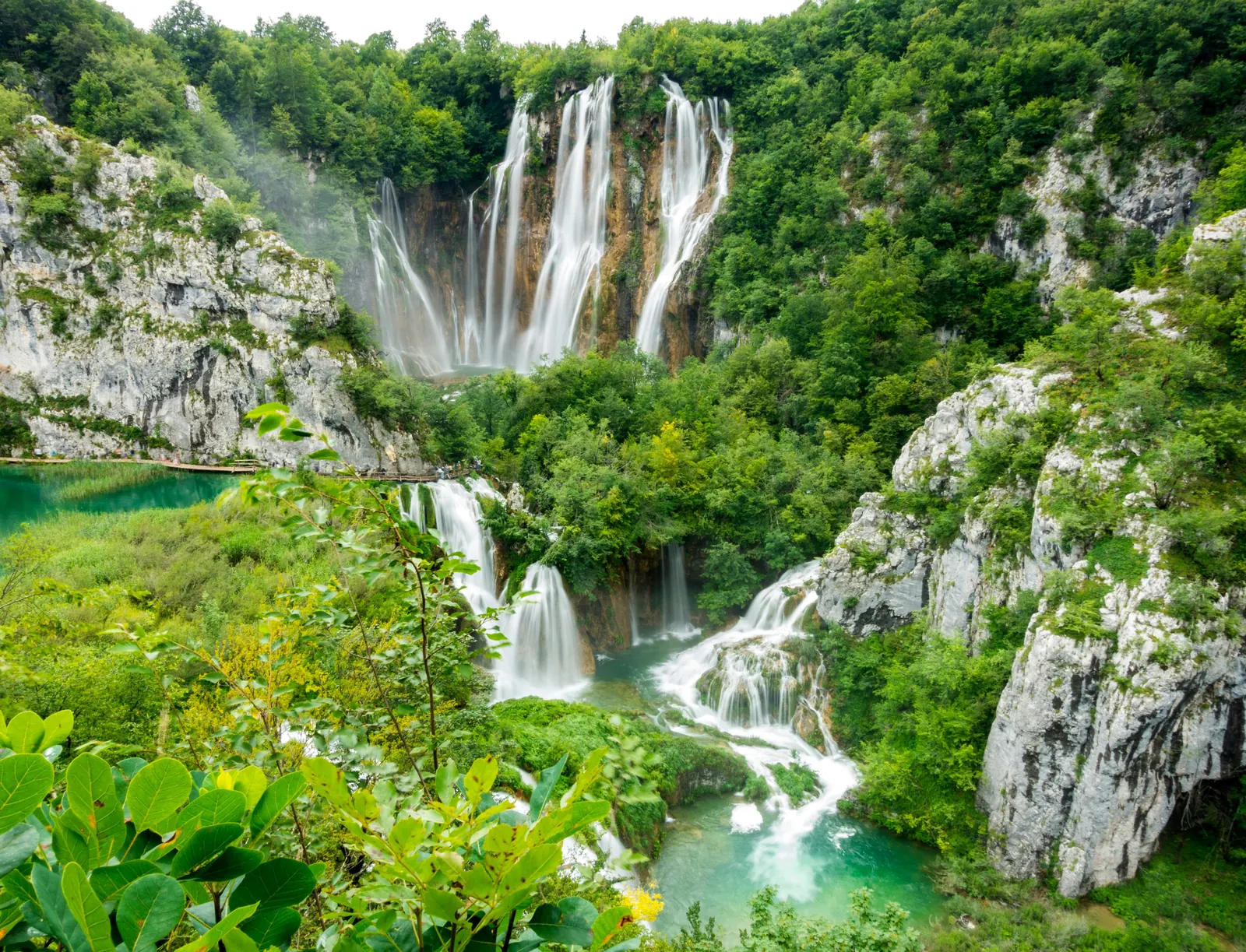 Waterfalls cascading through the forested limestone canyons of Plitvice Lakes National Park