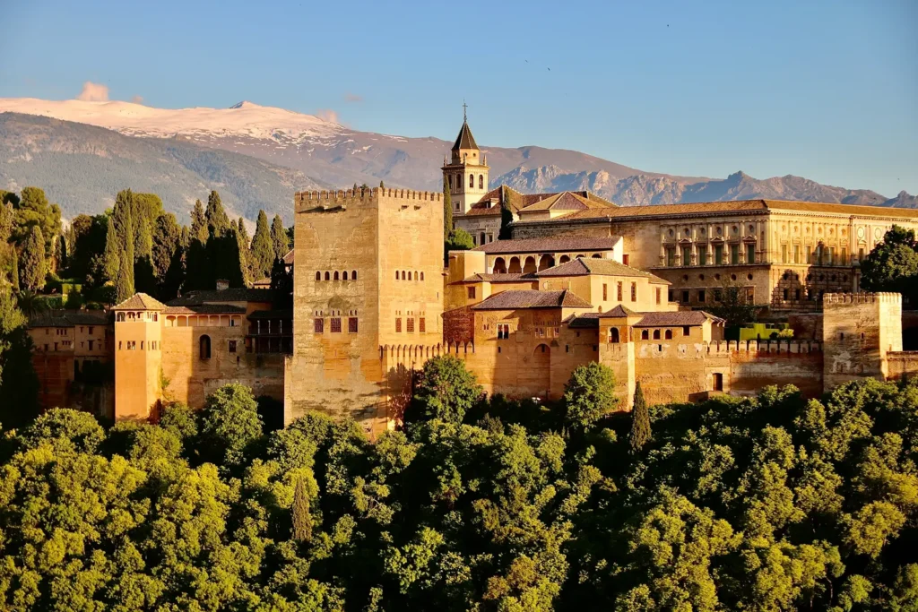 The Alhambra in Granada, Spain, with the snow-capped Sierra Nevada mountains rising behind it