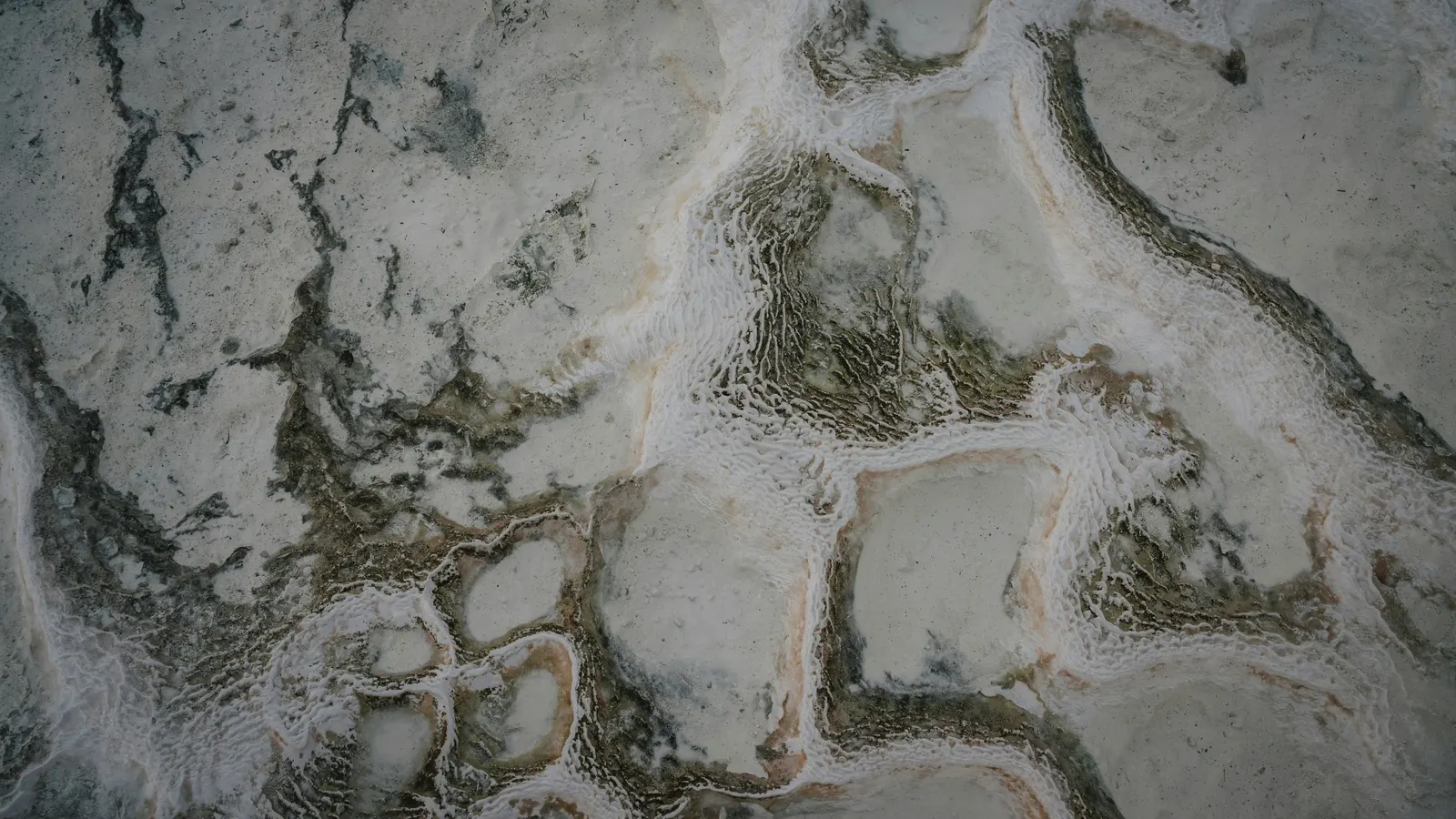 Aerial view of Pamukkale's white travertine terraces and turquoise mineral pools